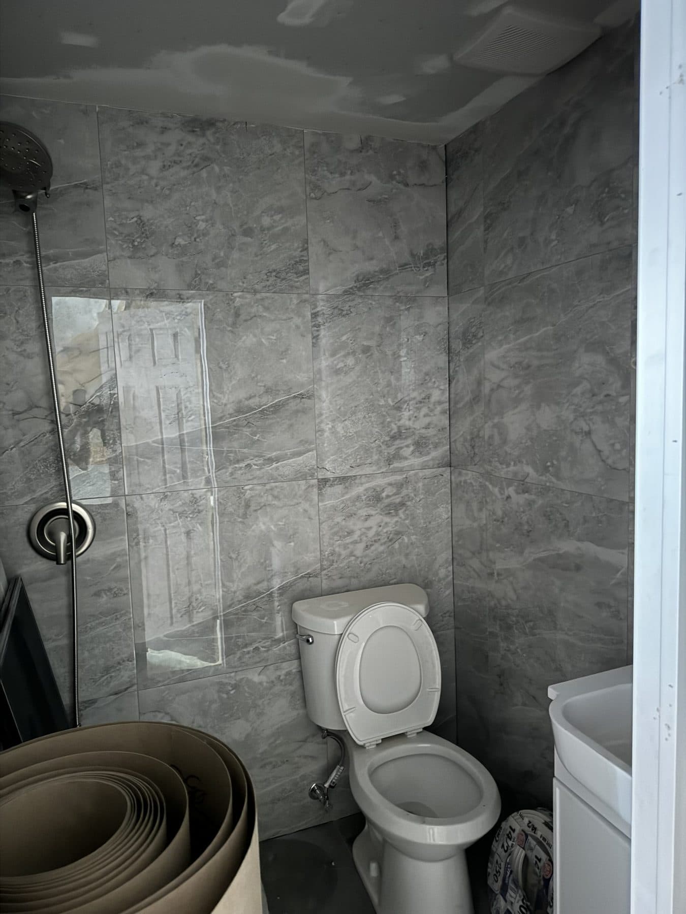Bathroom tile going up before fixtures, South Philadelphia