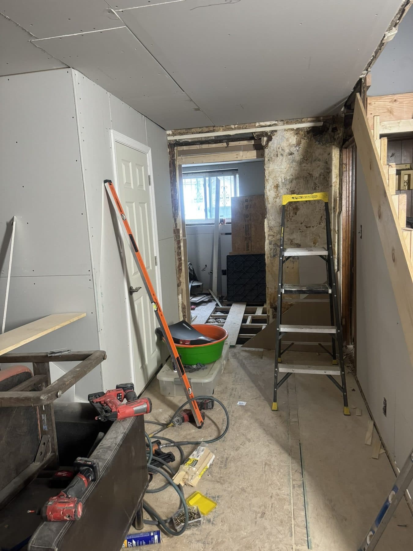 Old staircase removed and new stringers set in a gutted rowhome